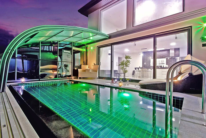 A Lean To Pool Enclosure Attached to a house so that the pool area can transform into an indoor space